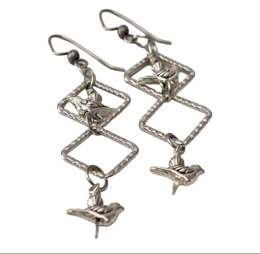 Silver Birds in Triangle Frames